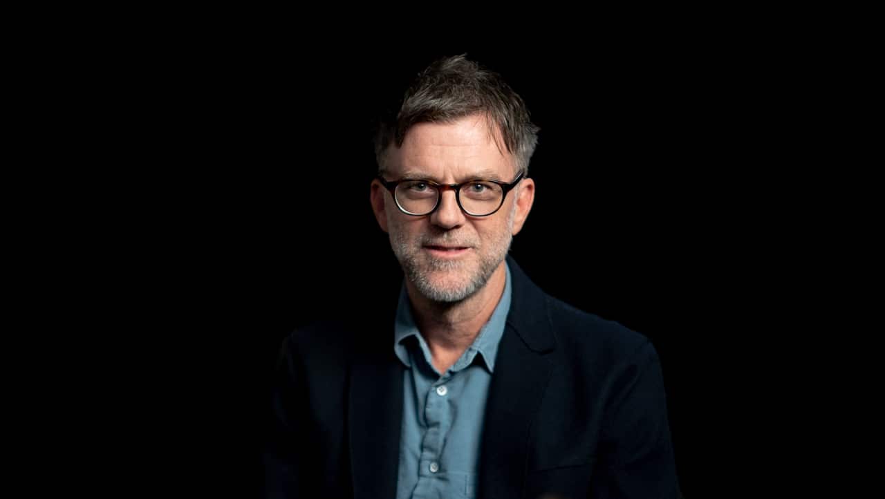 Director Paul Thomas Anderson smiles at the camera.jpg