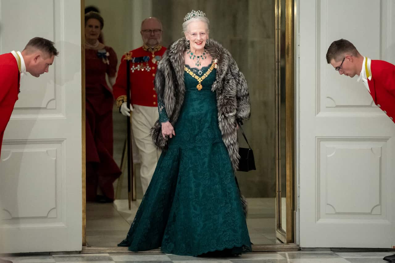 Queen Margrethe wears regal green and her tiara to a gala dinner.