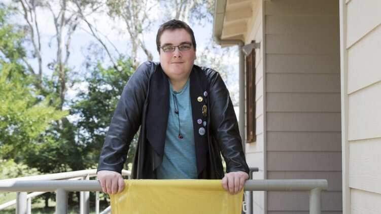 Cody Smith standing on a balcony