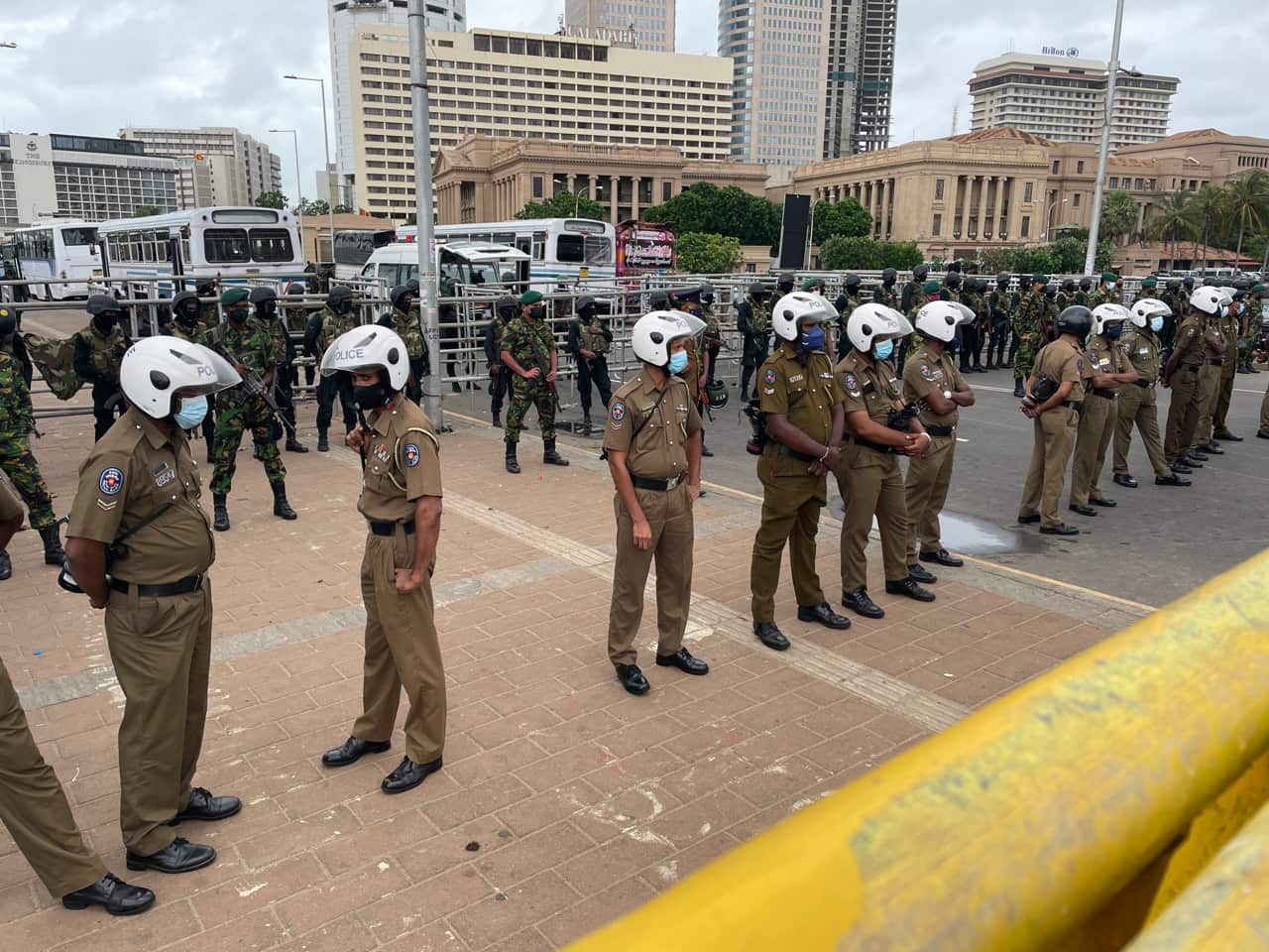 Police face protesters in Sri Lanka. 
