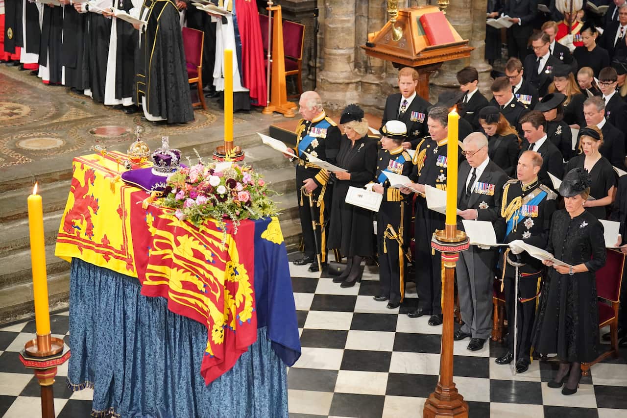 The royals stand in front of Queen Elizabeth's coffin during her state funeral at Westminster Abbey.