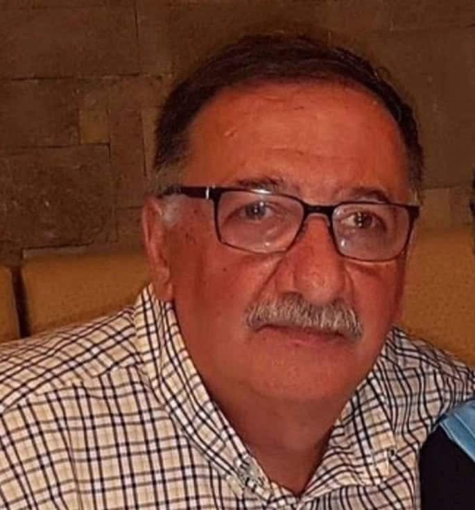 A man wearing a chequered shirt.