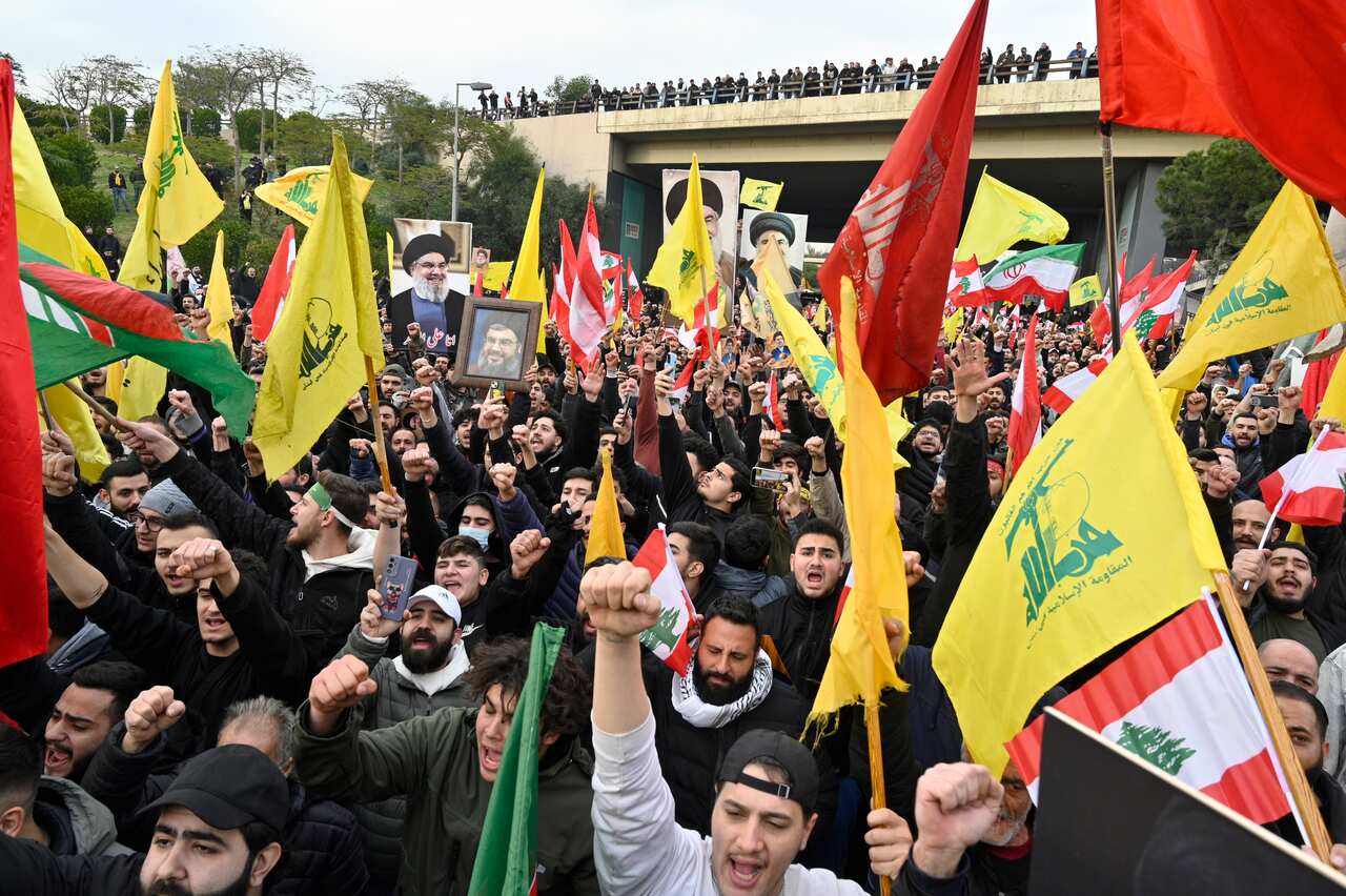 Hezbollah supporters protest at the entrance to Rafic Hariri International Airport