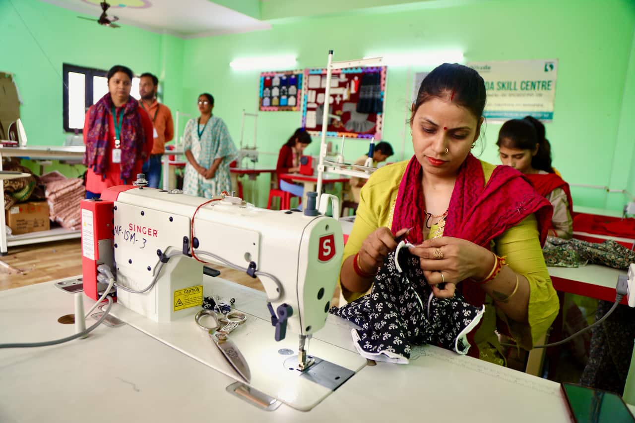 A woman at a sewing machine