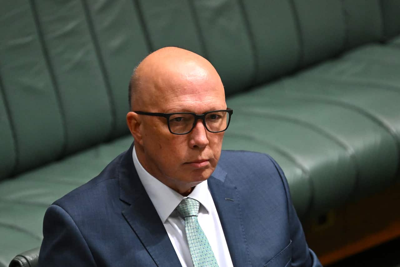 Peter Dutton sitting in parliament.