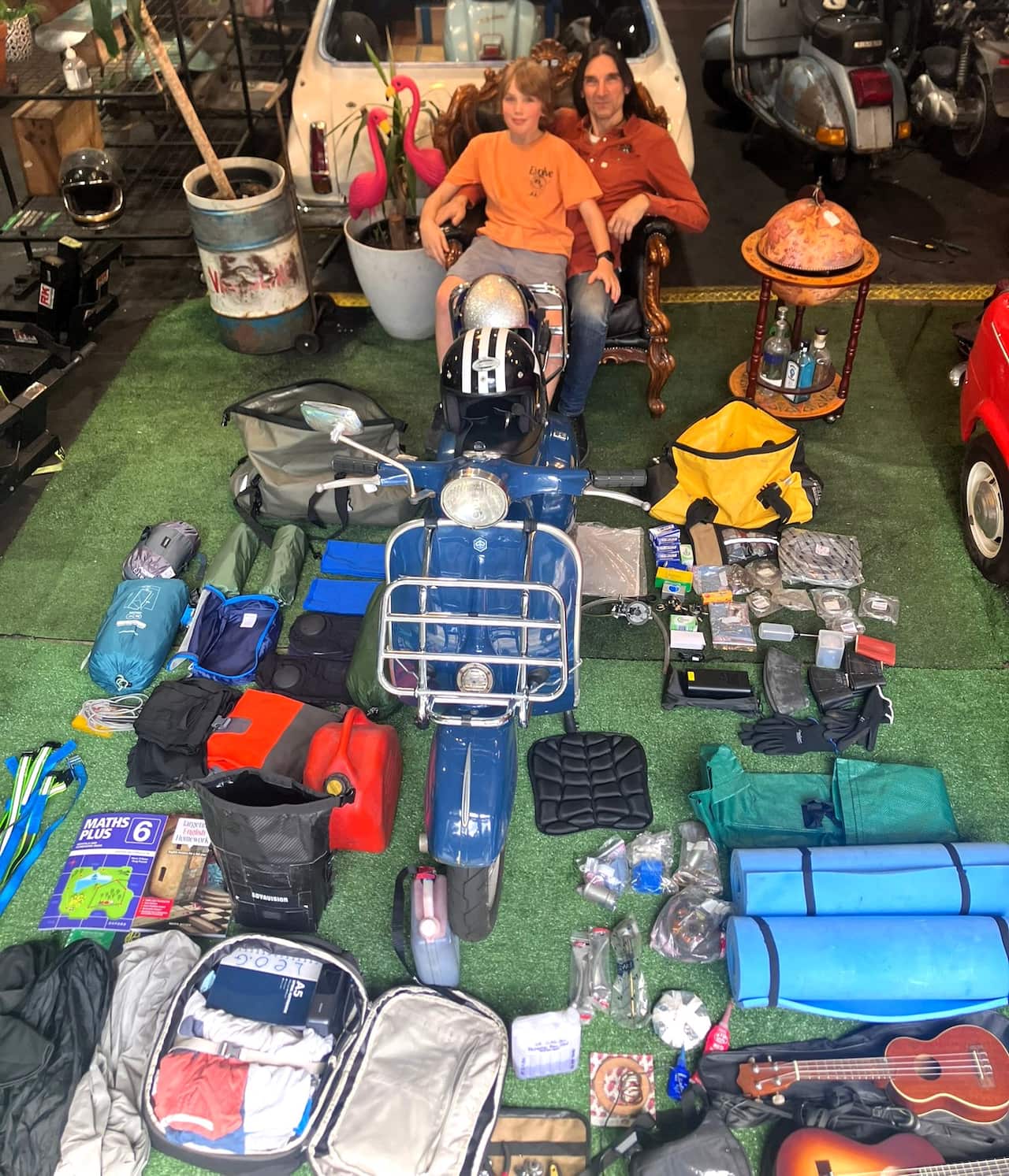 Leonardo and Mario in their garage with the necessary equipment on the eve of departure.