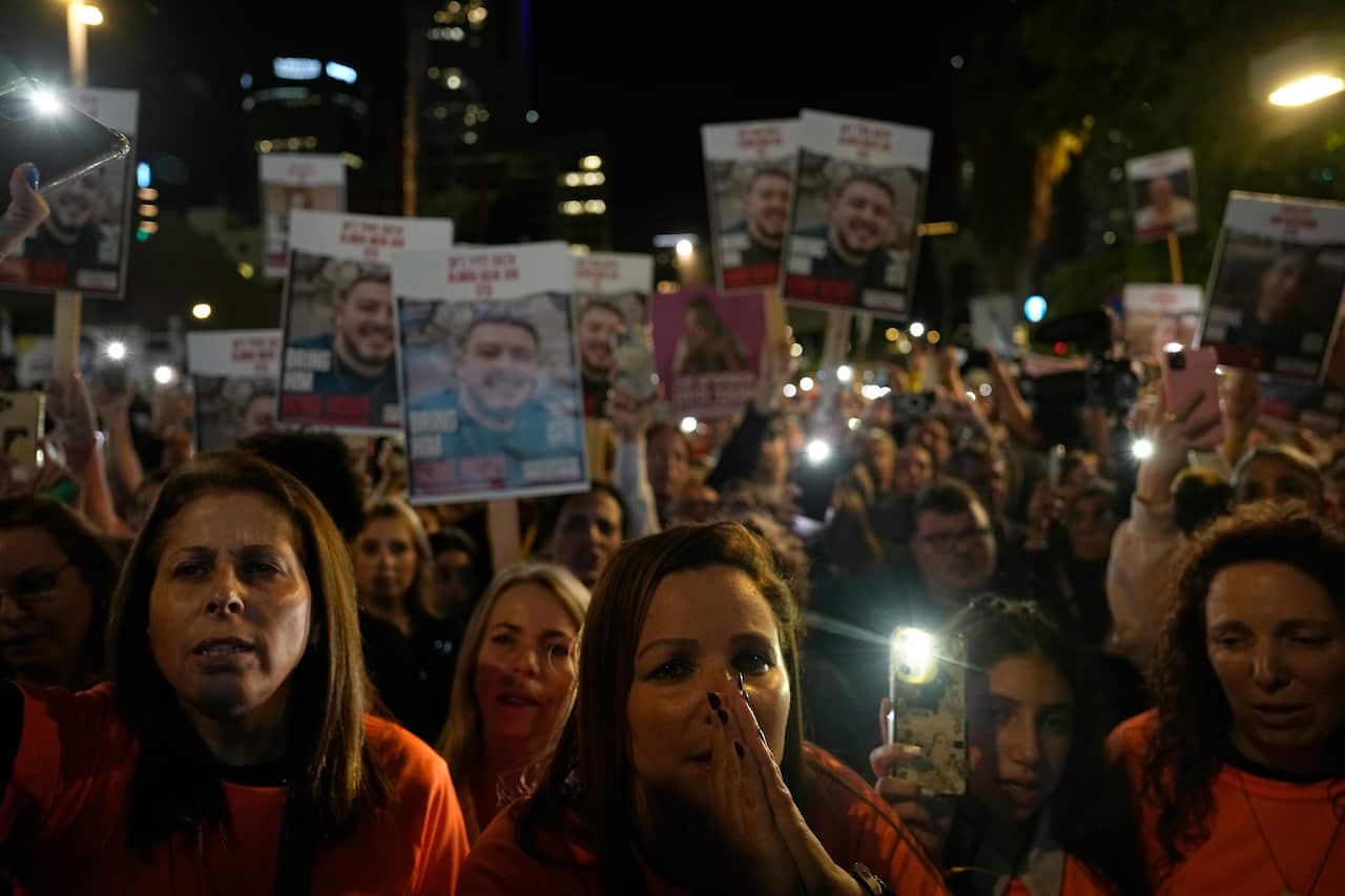People seen in a crowd wearing orange tshirts