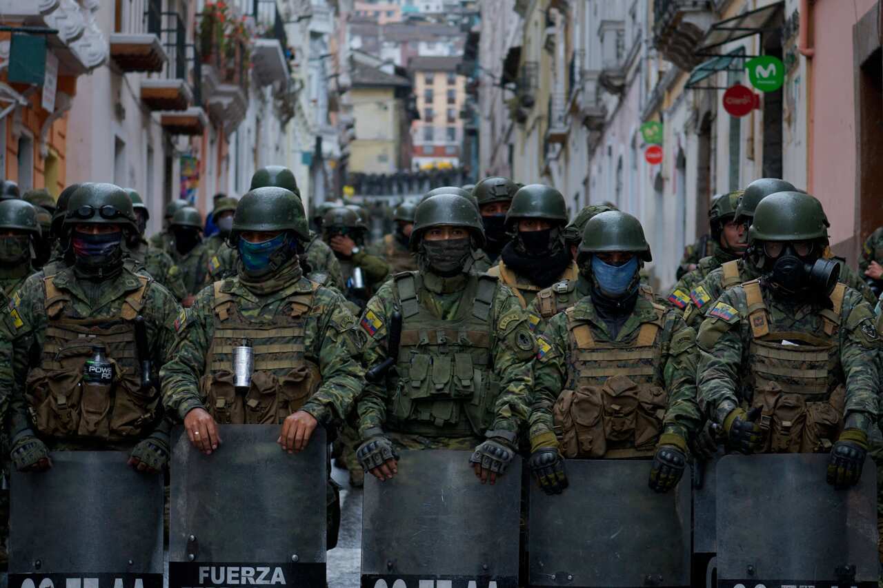 Soldiers stand guard at the historical centre in Quito.