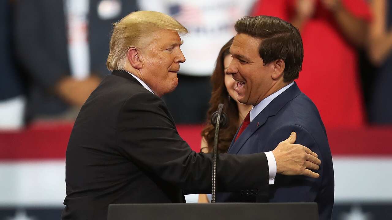 Donald Trump and Ron Desantis speak at a campaign rally.