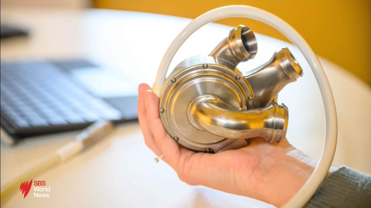 Journalist reports on an Australian man leaving hospital with a total artificial heart implant.