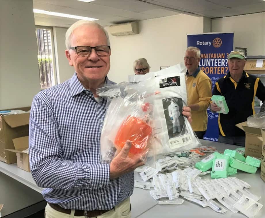 Rotary's Keith Roffey holding donated medial aid.
