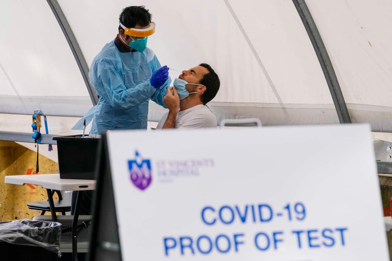 A man receives a COVID-19 test