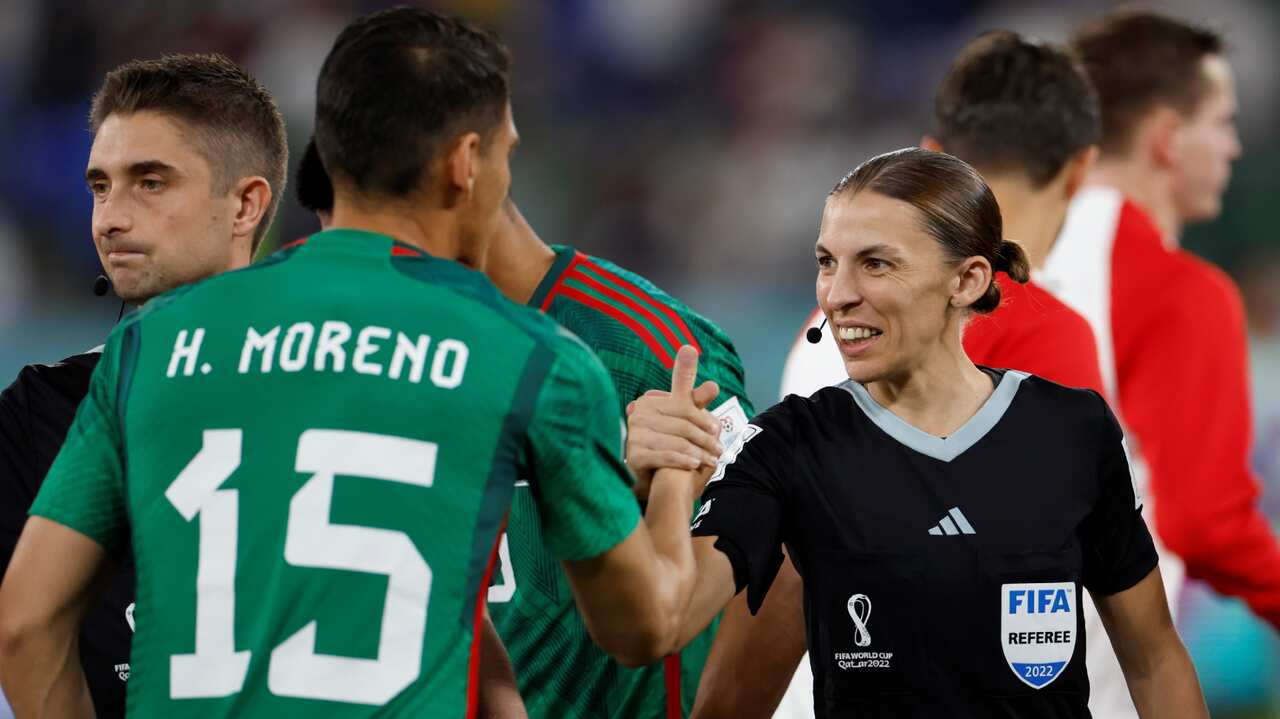 Referee Stephanie Frappart interacts with Hector Moreno of Mexico before a FIFA World Cup match