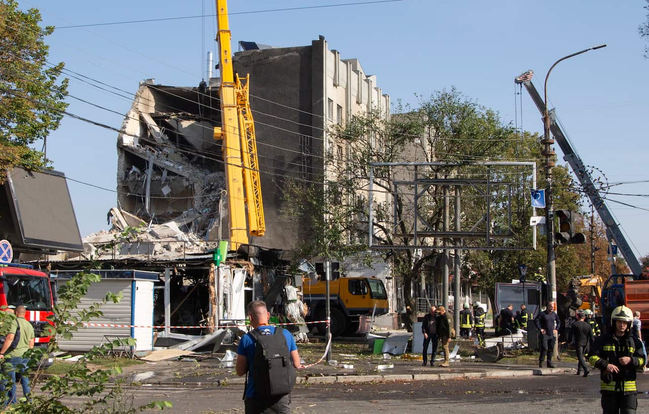 A damaged building that is being demolished.