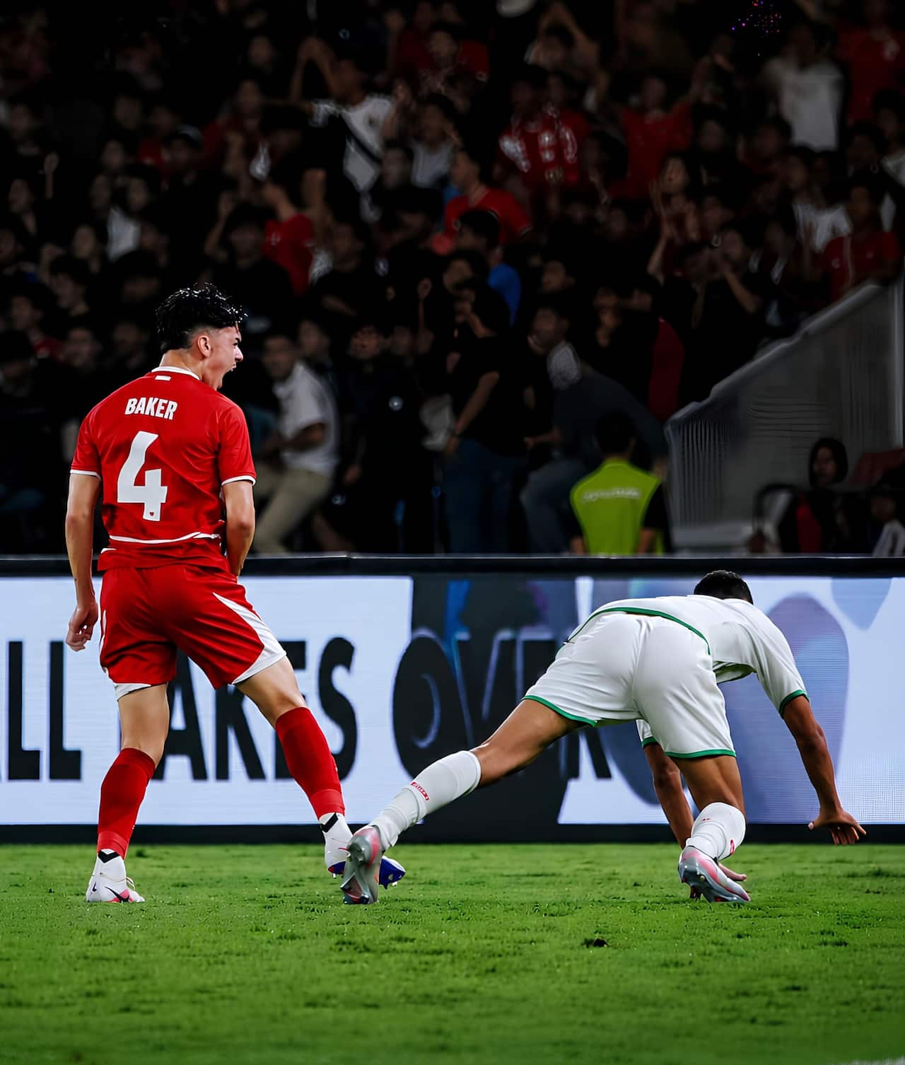 Mathew Baker, the youngest player to debut for Indonesia's senior team, in action wearing the Timnas Indonesia jersey.