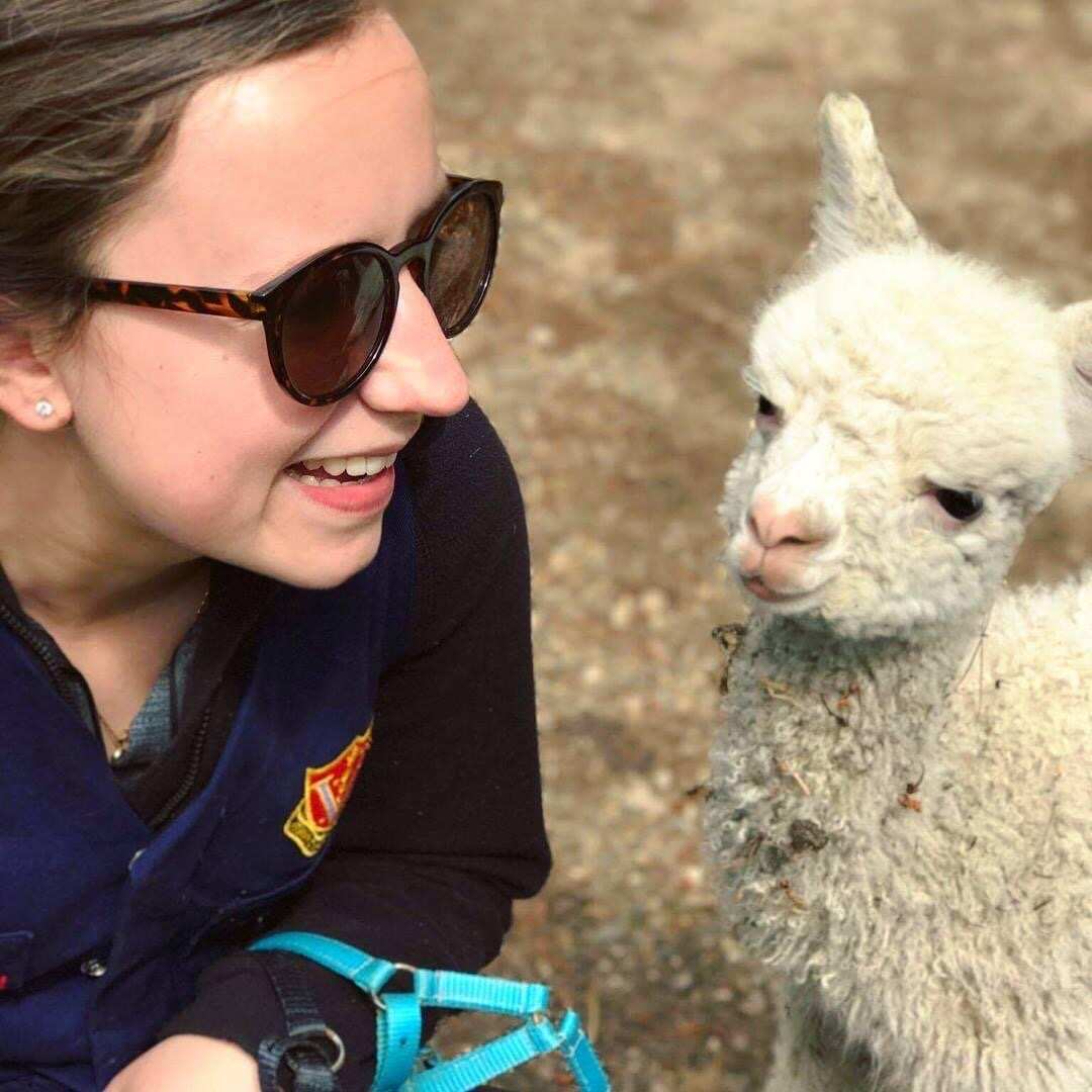 Tori pictured with a lamb.