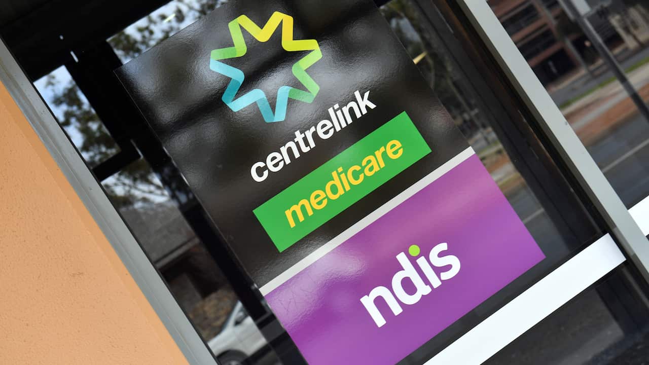 Building door with signs for Medicare, Centrelink and NDIS.