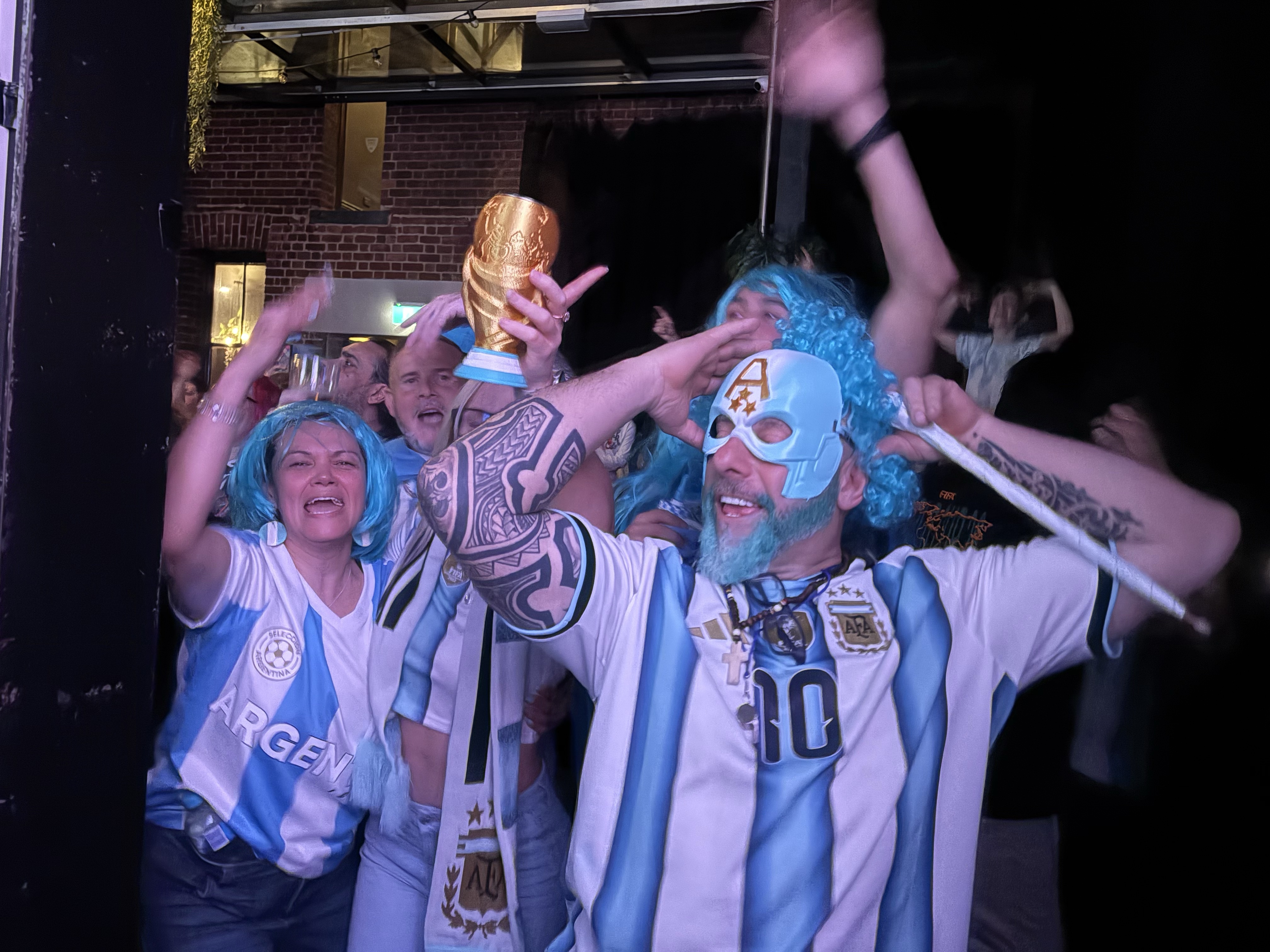 Argentina fans celebrate at a watch party for the FIFA World Cup 2026 final.