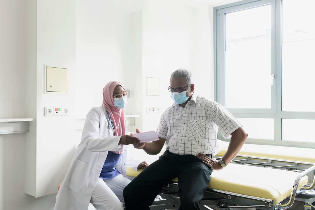 Senior man receiving prescription