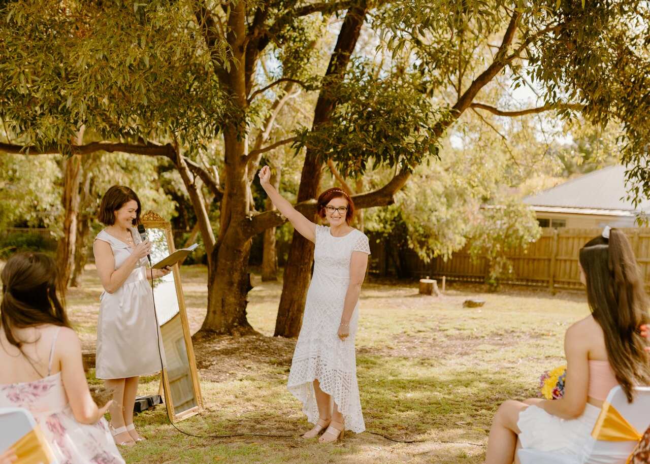 Woman standing in front of crowd. 