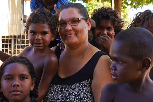 Bettina Danganbarr surrounded by children 