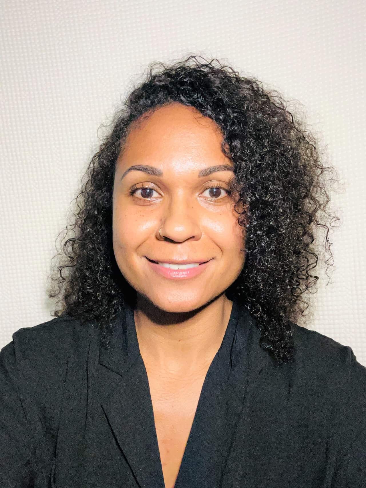 A headshot of a woman smiling