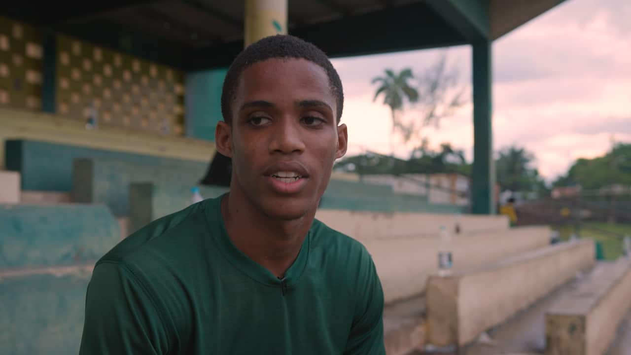 A young man in a green t-shirt 