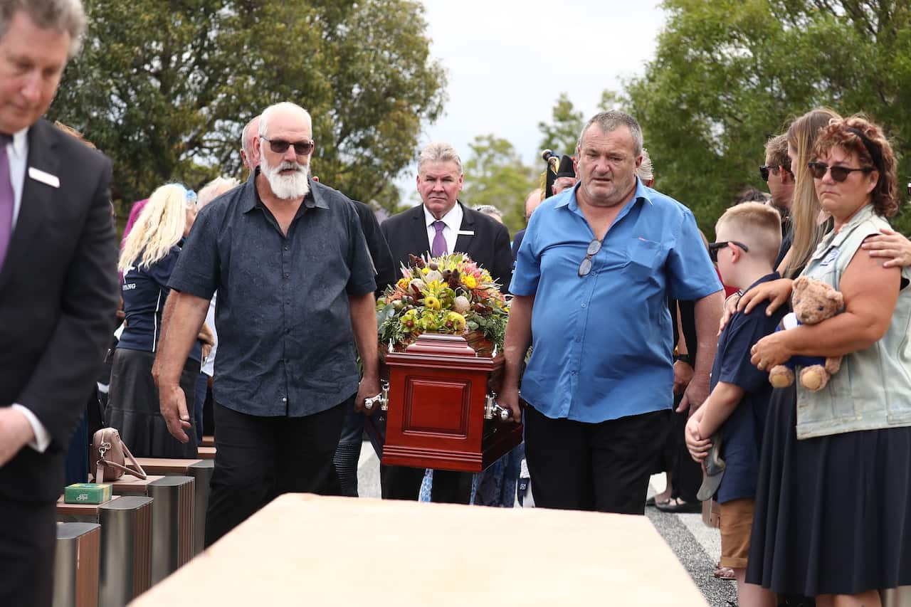 Friends and family carry the coffin of Alan Dare during the funeral service at Centenary Memorial Gardens in Wacol near Ipswich.