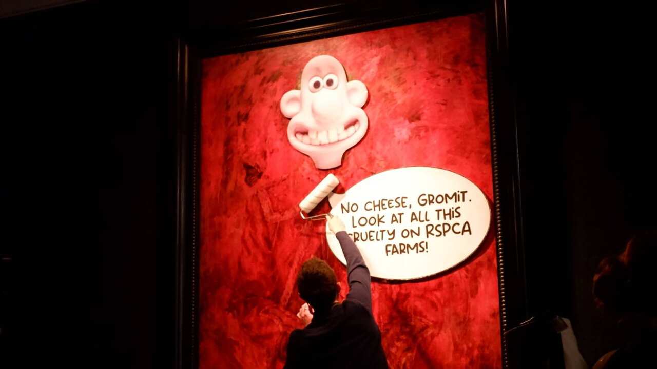 Animal rights protesters 'redecorate' portrait of Britain's King Charles at London art gallery