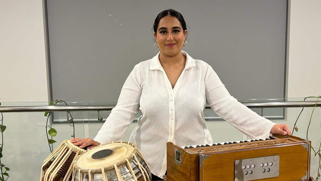 Sukhleen with her favourite musical instruments 16x9.jpeg