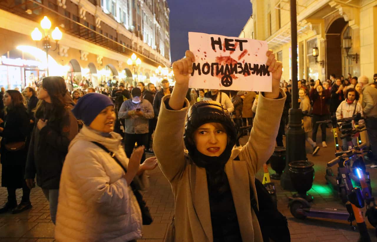 An activist holding anti-mobilisation poster during an unsanctioned protest rally on 21 September 2022, in Moscow, Russia. The sign "Net mogilizacii", written in Cyrilic means "No burialization".
