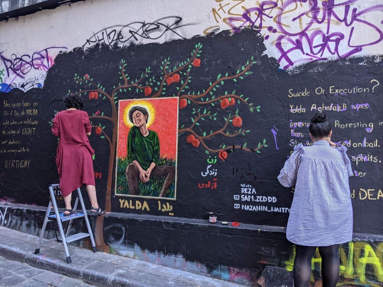 Nazanin and Samaneh working on Alda's graffiti 