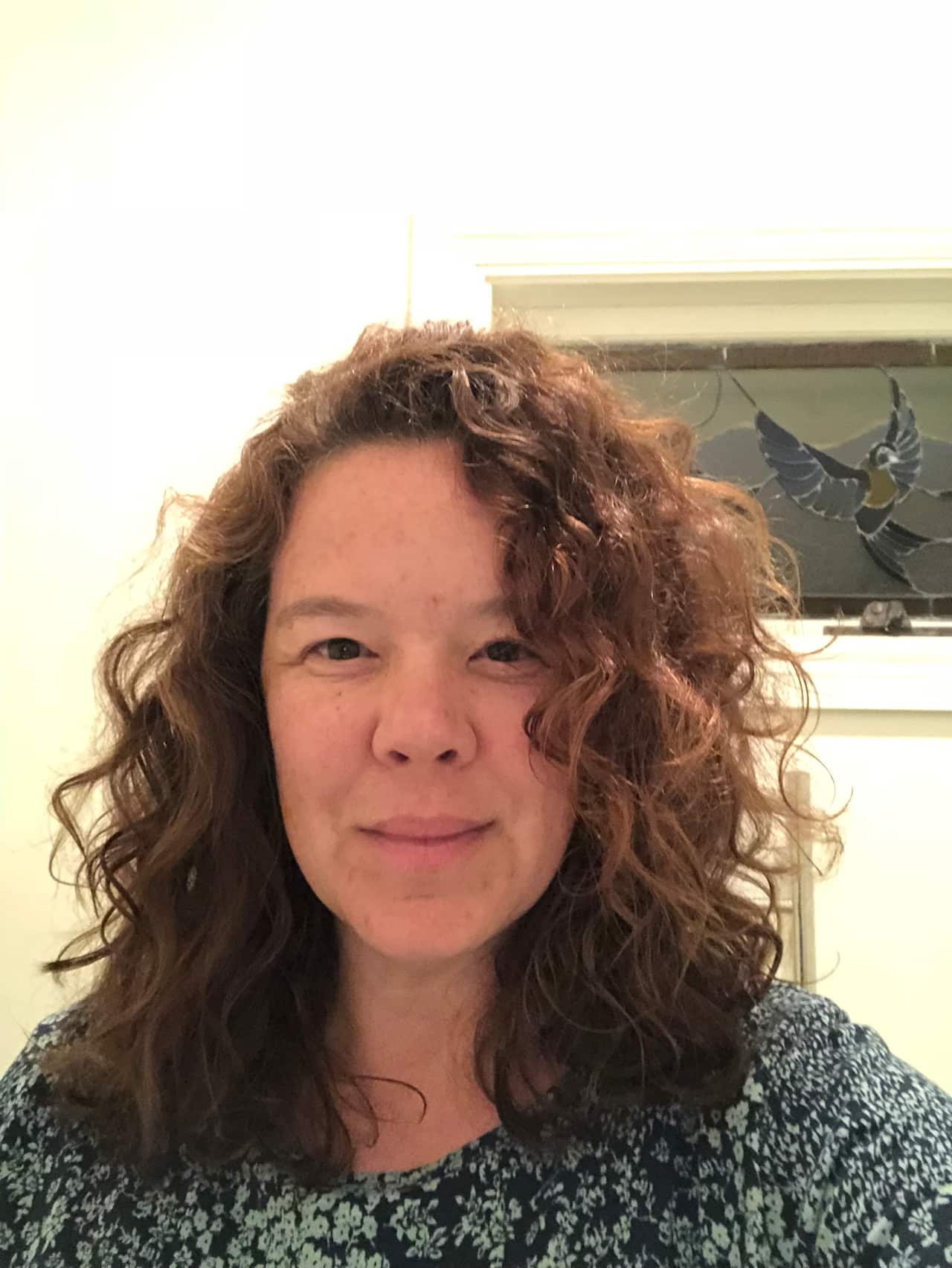 Denise Caruso looks at the camera and smiles in this profile photo.