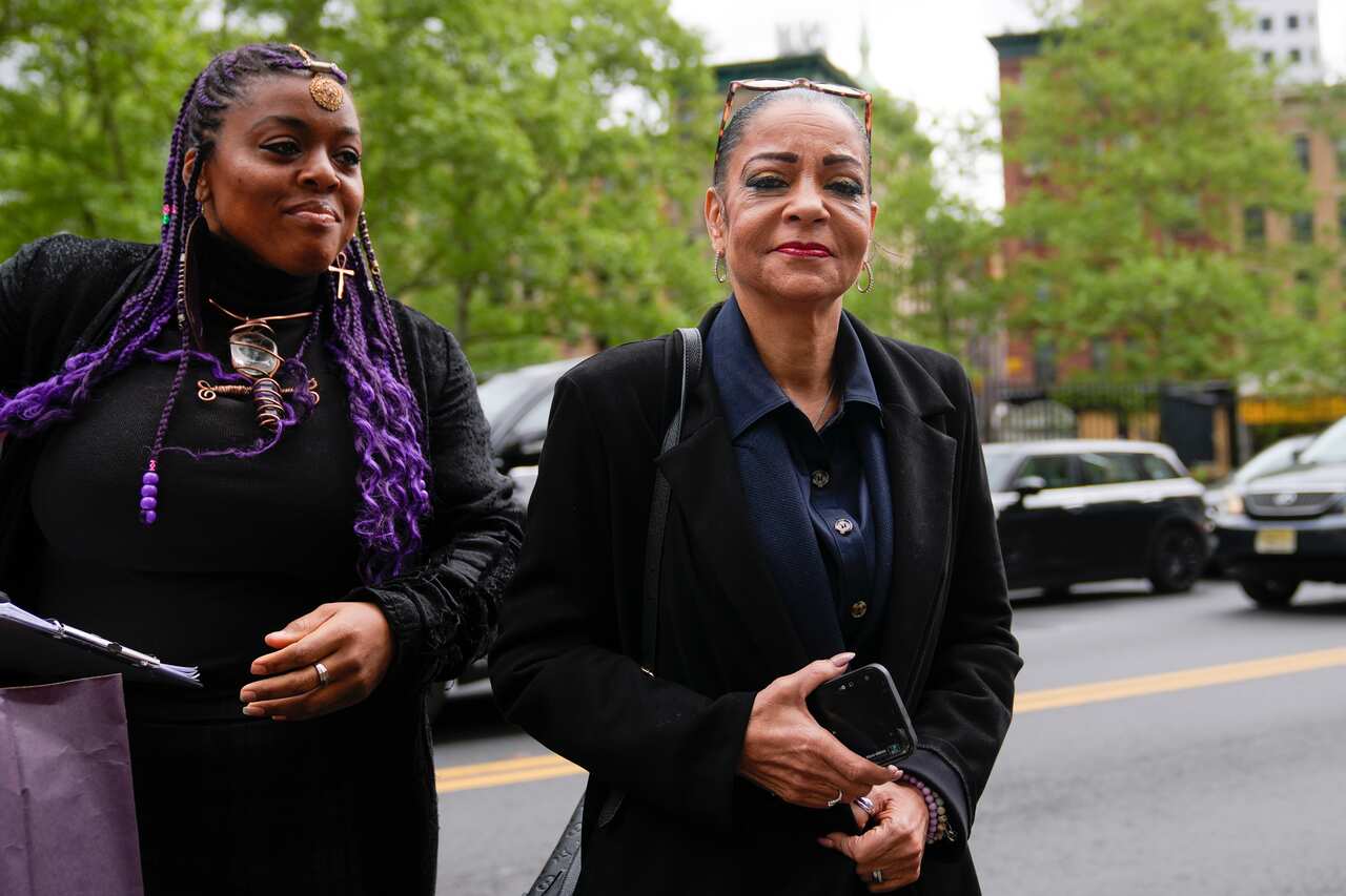 Two women walking outside.