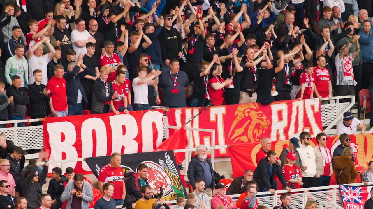 Fans standing at a Middlesbrough home match.