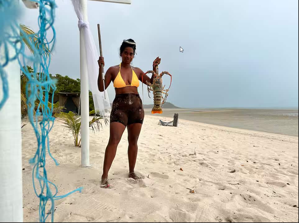 Nancy Nona catches fresh produce from the sea (the farm as she calls it) to serve guests. new.png
