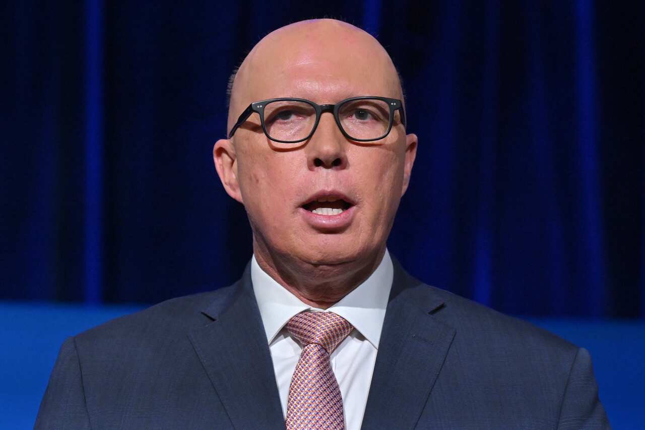 A man with glasses speaks.