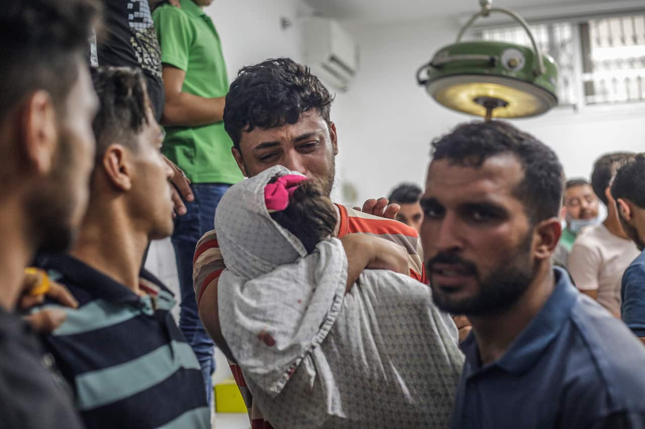 Palestinians attend the funeral of five-year-old Alaa Qaddum