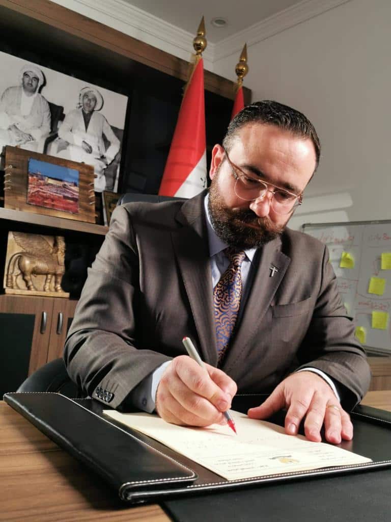 Minister Abdoka at his desk in the ministry