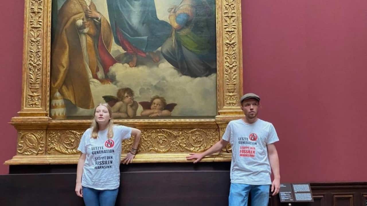 German climate change protest stuck to a Raphael painting.