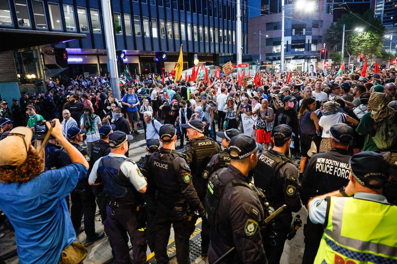 A group of pro-Palestinian protesters face off with police in Sydney's CBD