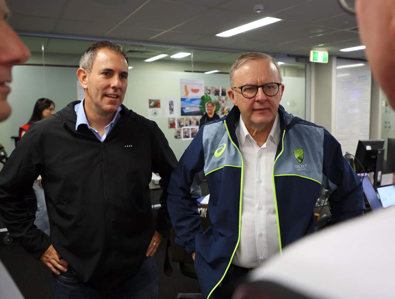 Anthony Albanese (right) stands next to a man in a dark jumper.