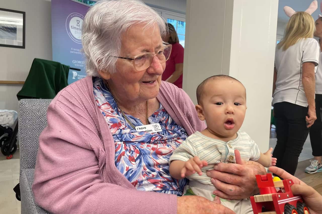 Carmel Bollard enjoys time with Charlie during a playgroup in Sydney's south_Rayne Tamer_SBS.jpg