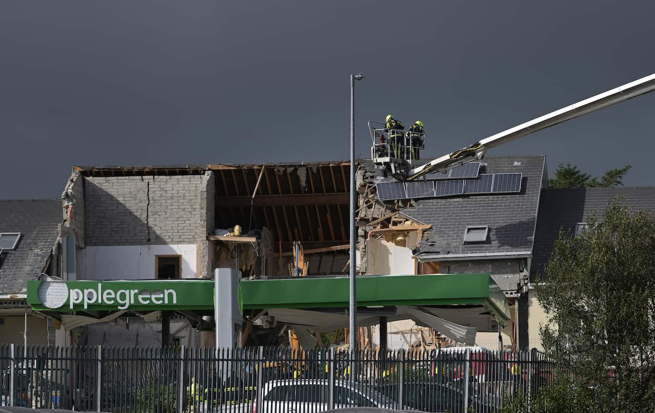 Emergency service workers at the scene of a petrol station explosion in Ireland.