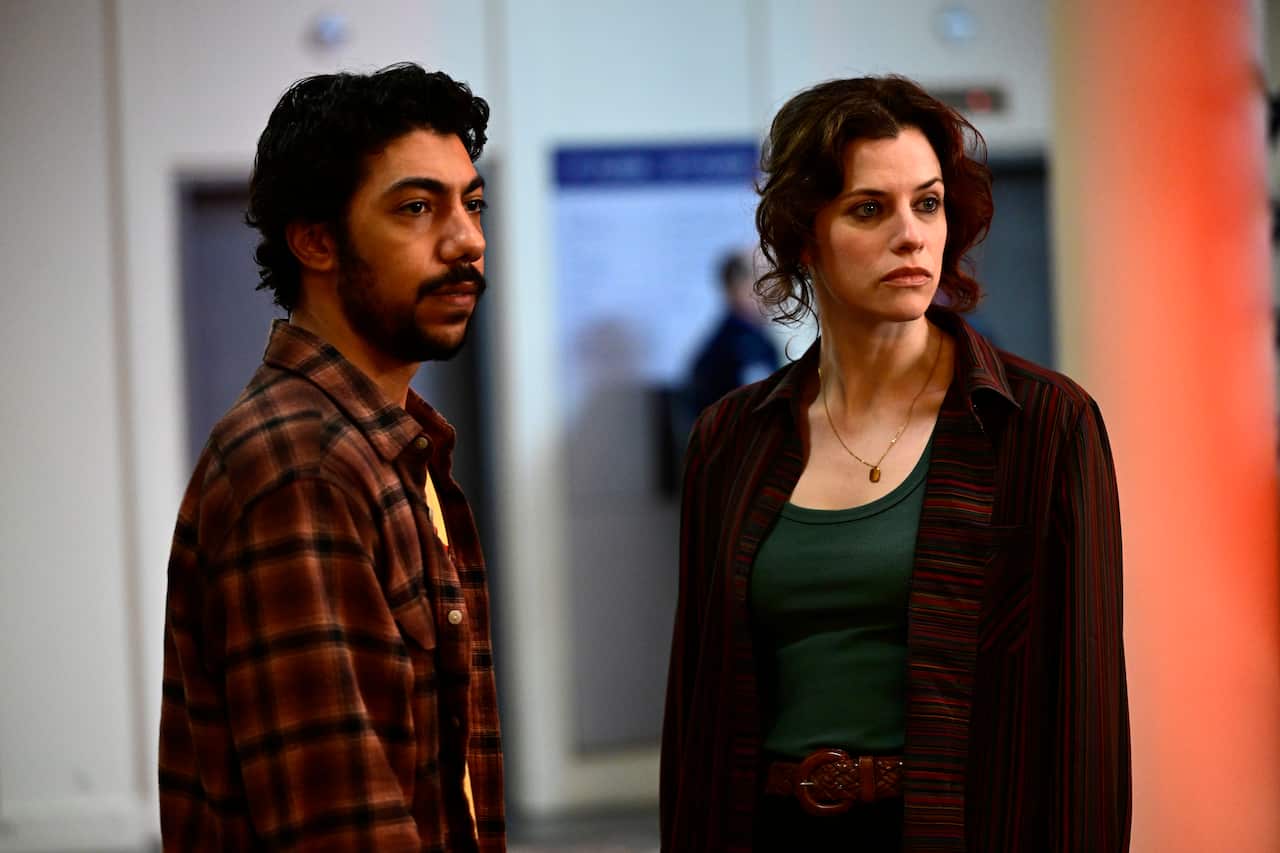 A man and a woman standing next to each other.