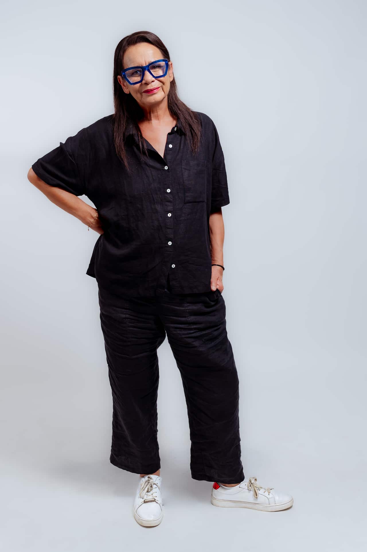 A woman standing and posing for a photo.