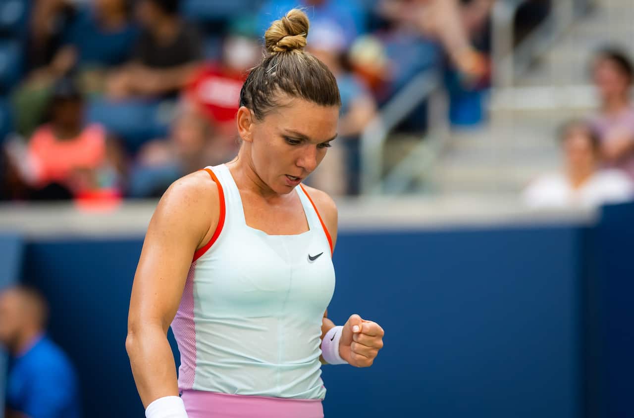 Simona Halep of Romania celebrates winning a point against Daria Snigur of Ukraine at the US Open Tennis Championships in New York City on 29 August 2022.