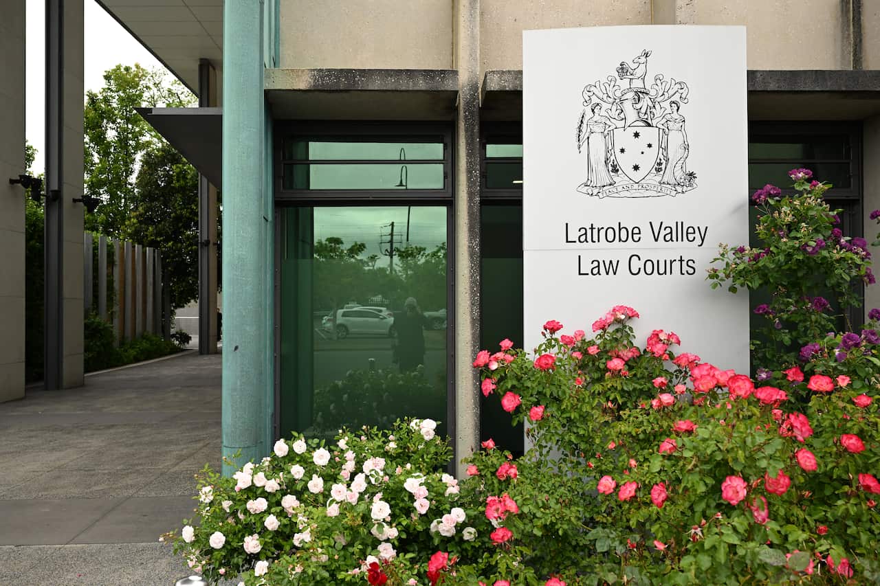 Flowers outside a court building with a sign that reads Latrobe Valley Law Courts