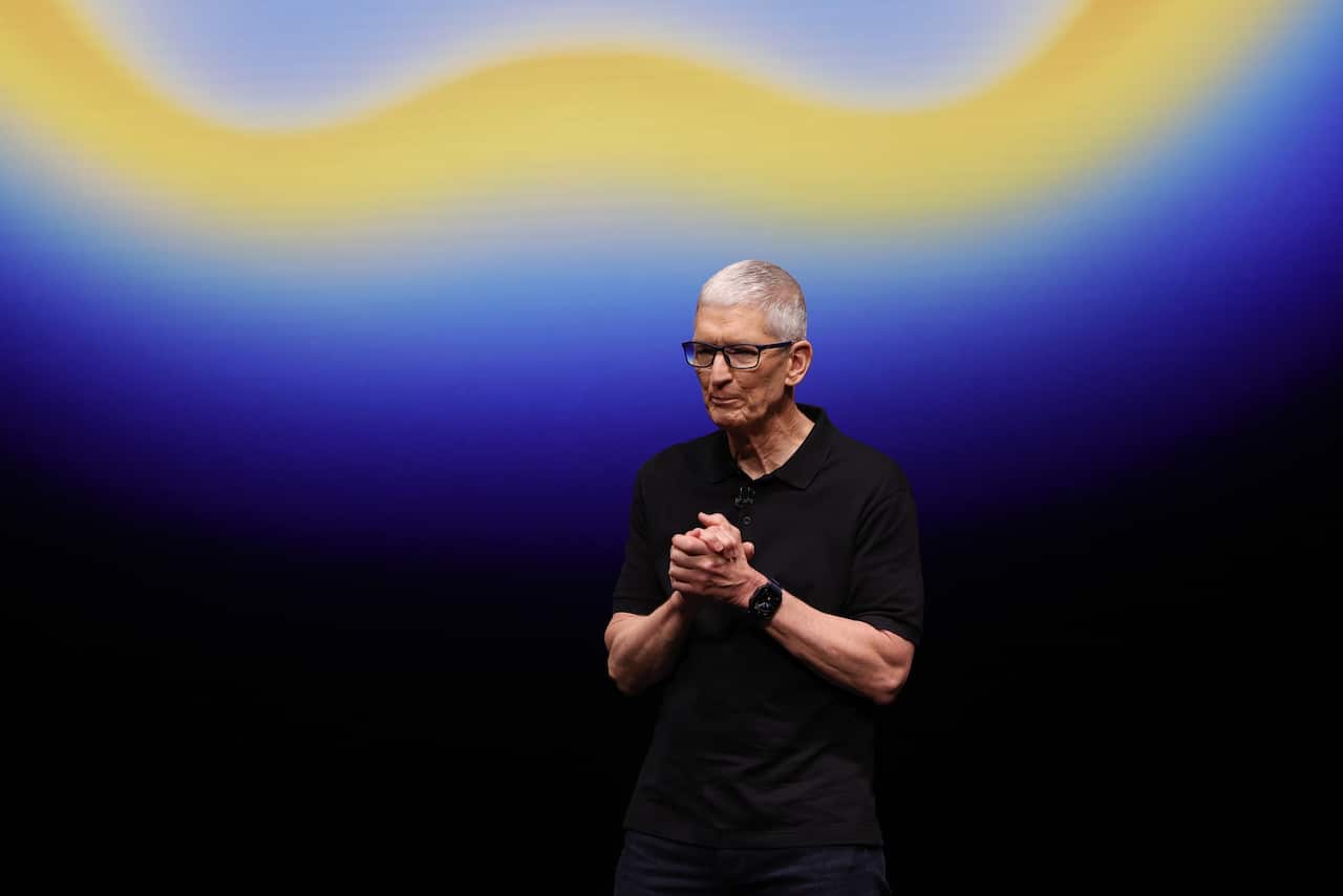 Tim Cook, standing in front of a colourful display.