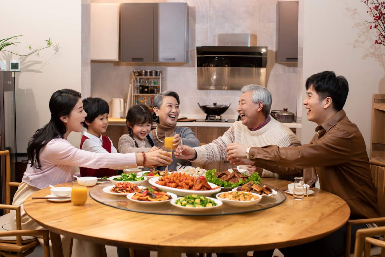 Happy family having Chinese New Year dinner